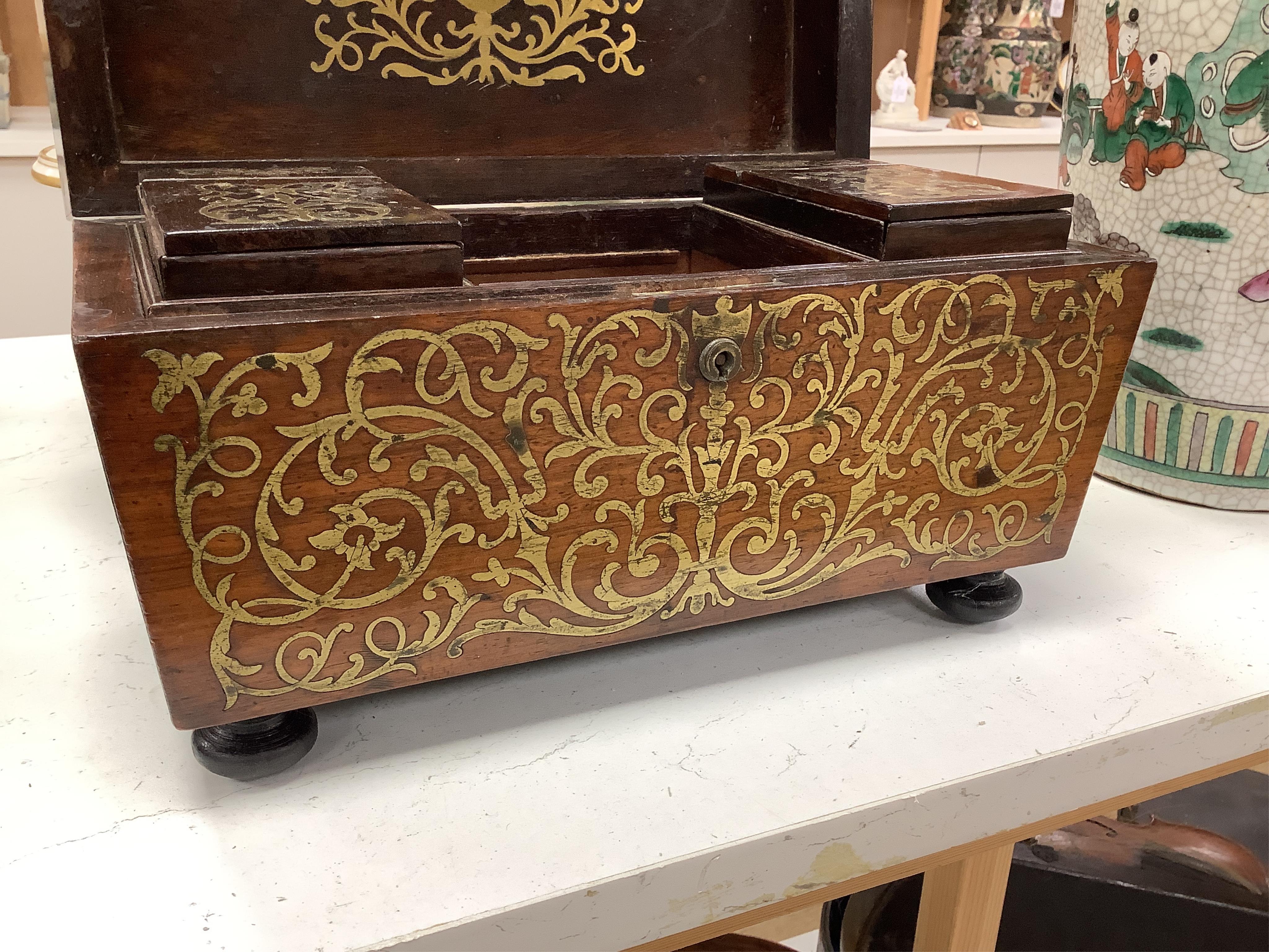 A William IV rosewood and cut brass inlaid tea caddy, 32cm wide